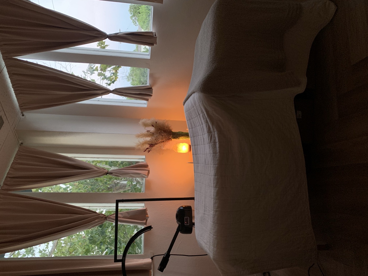 The treatment room at dusk, lit by a salt lamp